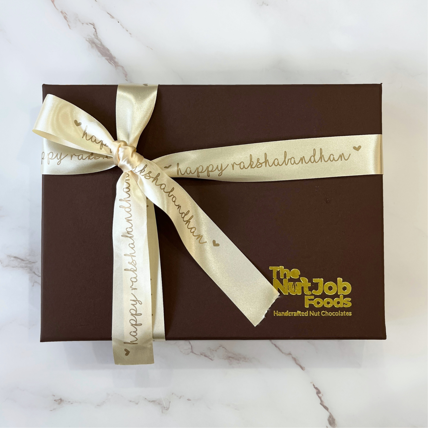 Rakhi Gift Box - 12 Pieces Assorted Chocolate Dates with Evil Eye Rakhi and Note - Raksha Bandhan Gift